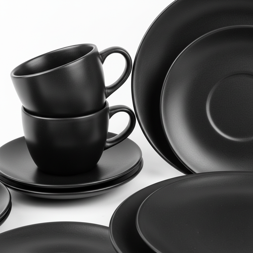 Close-up matte black cups and plates